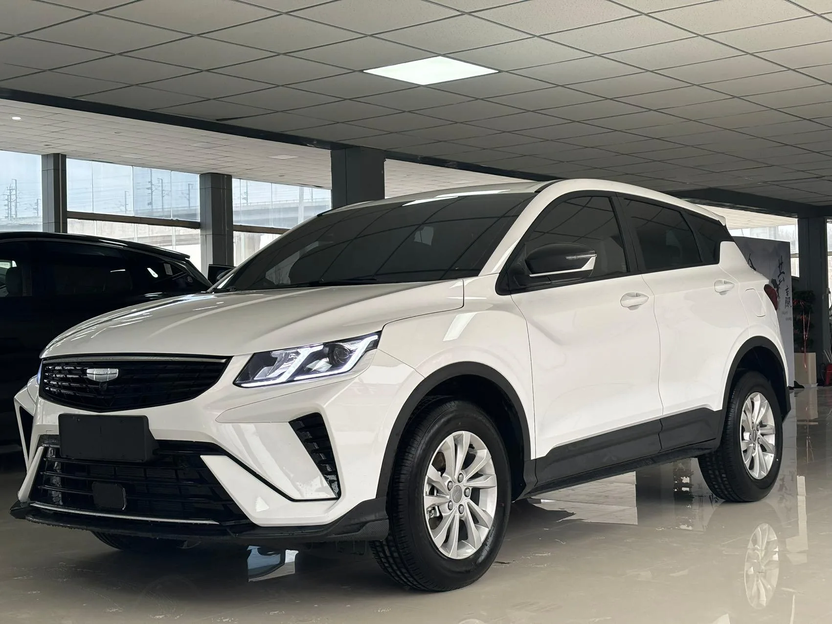 Silver Geely Binyue front three-quarter view, representative China-market vehicle